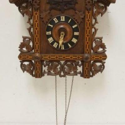 1123	CARVED CUCKOO CLOCK, SOME LOSS TO CARVING, SOLD AS FOUND FOR RESTORATION, APPROXIMATELY 12 IN X 8 IN X 25 IN HIGH

