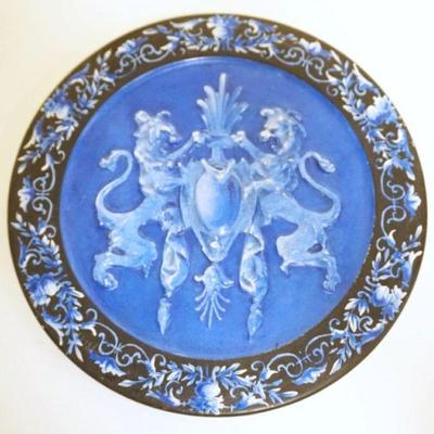 1047	PORCELAIN 8 IN ROUND PLATE W/EMBOSSED RAMPANT LIONS ON CREST

