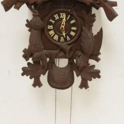 1125	CARVED CUCKOO CLOCK, SOME LOSS TO CARVING, SOLD AS FOUND FOR RESTORATION, APPROXIMATELY 17 IN X 10 IN X 26 IN HIGH

