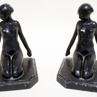 1061	CAST METAL BOOKENDS W/IMAGE OF NUDE WOMAN KNEELING BACKWARDS, APPROXIMATELY 5 IN X 5 IN X 6 IN HIGH
