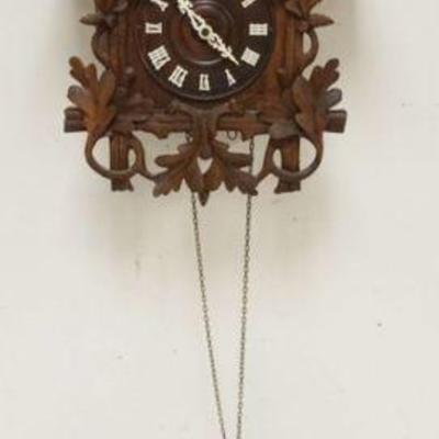 1126	CARVED CUCKOO CLOCK, SOME LOSS TO CARVING, SOLD AS FOUND FOR RESTORATION, APPROXIMATELY 17 IN X 12 IN X 24 IN HIGH
