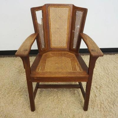 1225	MISSION OAK SIGNED LIMBERT ARM CHAIR, LOSS TO CANE
