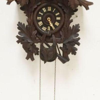 1130	CARVED CUCKOO CLOCK, SOME LOSS TO CARVING, SOLD AS FOUND FOR RESTORATION, APPROXIMATELY 18 IN X 12 IN X 26 IN HIGH
