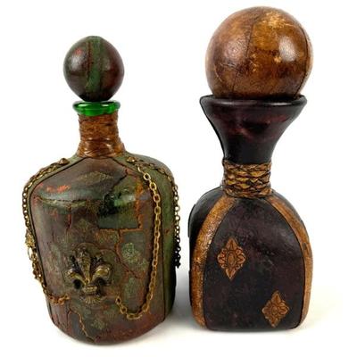 #89 • 2 Vintage Leather Covered Glass Decanters with Stoppers
WWW.LUX.BID