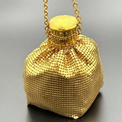 #221 • Whiting & Davis Company Golden Metal Mesh Accordion Pouch
WWW.LUX.BID