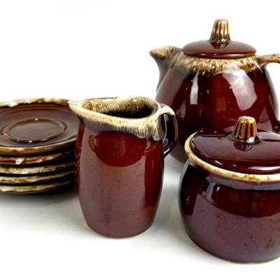 #29 • Hull Brown Drip Teapot, Creamer, Sugar Bowl & 5 Monmouth Saucers
WWW.LUX.BID