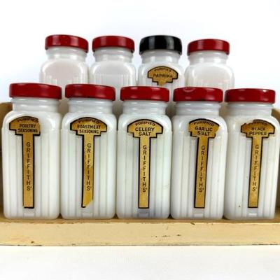 #83 • 9 Griffith Milk Glass Spice Jars & Wood Rack
WWW.LUX.BID