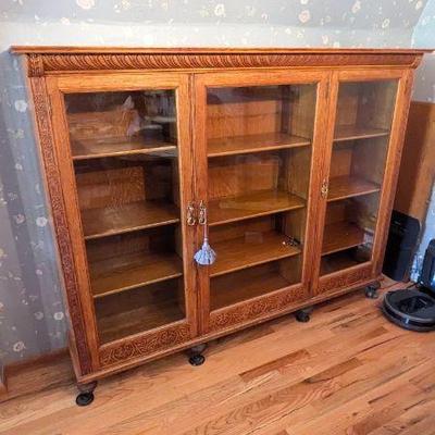 Antique Wooden Display Cabinet with Intricate Carvings