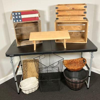 (12pc) Crates & Baskets | Lot of: (4) wooden display crates, (1) Earth Bench-Maine wood footstool, (3) wicker baskets, (2) black wire...