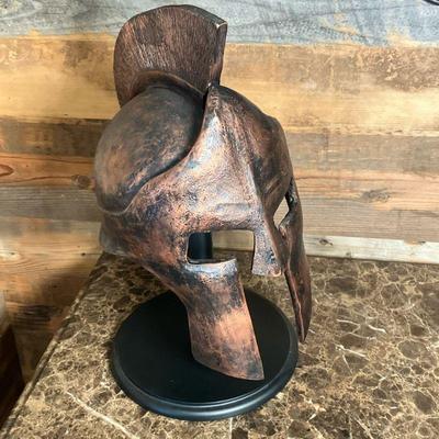 Spartan Gladiator Style Helmet | Gladiator Helmet on stand in a heavy composition with aged copper/bronze finish. Stand is black wood. -...