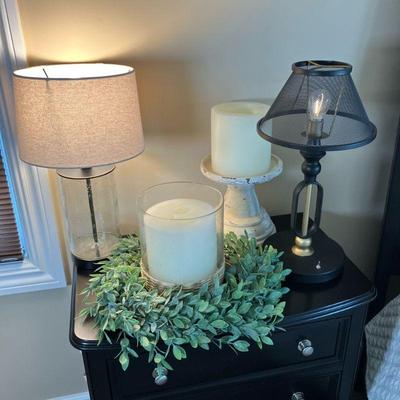 (4pc) Table Lamps & Candles | Includes: Painted black metal battery operated lamp, Glass Cylinder electric lamp with metal surround,...