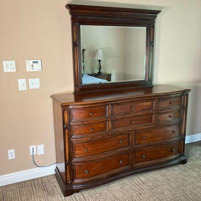 Universal Furniture Dresser & Mirror | 10 Drawer dresser in mahogany with attached mirror. Serpentine front. - l. 65" x w....