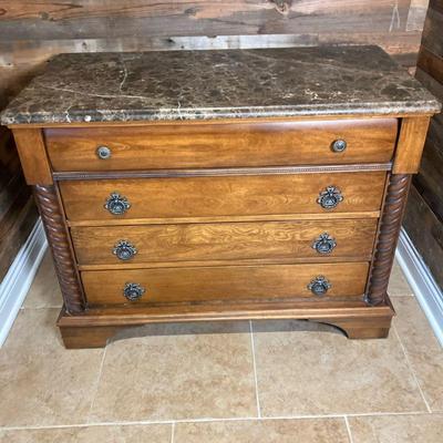 French Marble Top Chest | Unmarked PA House, Black marble top French style four drawer chest with nice hardware. Finish has faux...