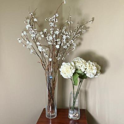 (2pc) Poland Glass Vases W/Silk Flowers | Lot Includes: * Tall Vase labeled “Hand Made in Poland”. Having silk Cherry Blossoms on...