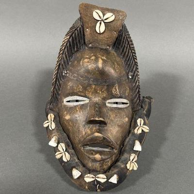 Lot 141 | Carved Wooden Dan Mask with Cowrie Shells
