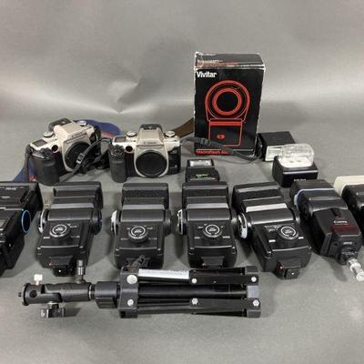 Lot 233 | 2 Canon Cameras, Vivitar Thyristors & Speedlites
