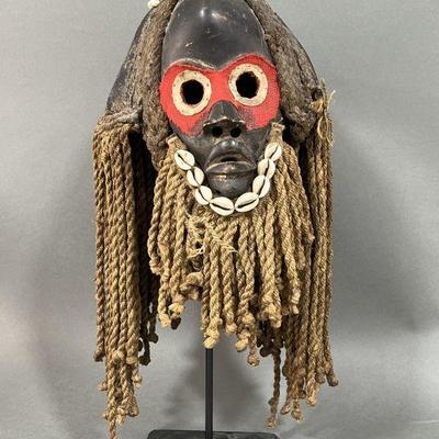 Lot 101 | Wooden Mask with Cloth Eyes & Cowrie Shells
