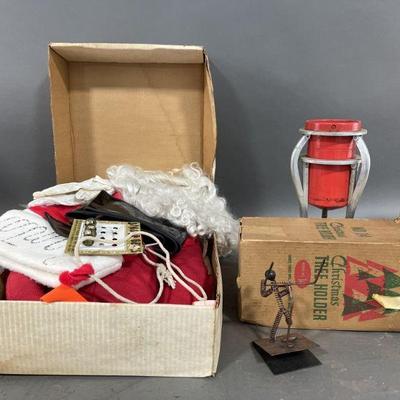 Lot 437 | Vintage Santa Suit, Christmas Tree Holder & More
q