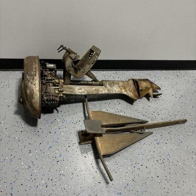 Lot 438 | Vintage Boat Motor & Anchor
