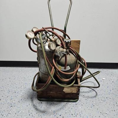 Lot 304 | 2 Gas Containers On Rolling Cart
