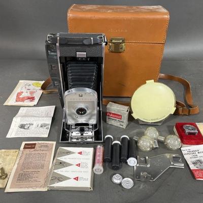 Lot 356 | 1950s Polaroid Land Camera 150 & Accessories

