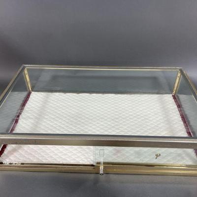 Lot 61 | Metal and Glass Display Case With Lock & Key
q