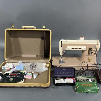 Lot 243 | Singer 301A Sewing Machine & Attachments
