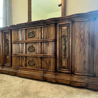 Dresser with Mirror by Burlington measuring 72" wide, 21" deep, and 33" tall without the mirror. 
$225