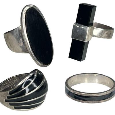 Four Sterling Silver and Onyx Rings