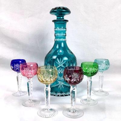 MAGR203 Vintage Bohemian Czech Cut To Clear Decanter Set	Multi color mini goblets and a Teal like color decanter. 
