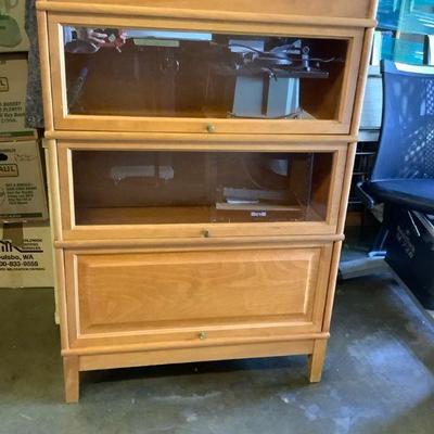 TEMA302 Hale Brand Barrister Bookcase	Barrister bookcase has 2 glass doors, 1 wood door and  shelves separate in 5 pieces.  Approximately...