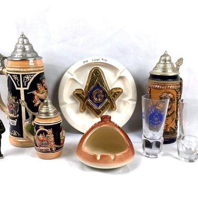MAGR207 Masculine Collectibles	3 different kind of beer steins, 1958 Nato beer stein, a Gerz stein and a Hager's Freud beer stein. 
