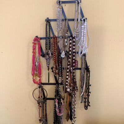 BEDO301 Necklaces For Every Occasion	Out of this lot there are 3 pieces with name stamped on the back.  This lot has a handy 2 piece wall...