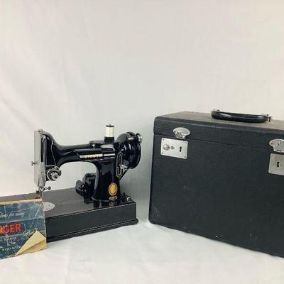 LOAN803 Singer Featherweight 221	Singer 221 sewing machine. Includes case and zig zag attachment. Tested and works.
