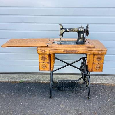 LOAN605 Antique "White" Pedal Sewing Machine	White family rotary sewing machine comes with original certificate of warranty...
