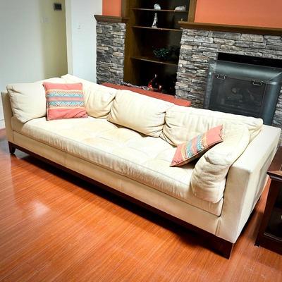 Pale yellow leather tuxedo-style sofa - finished on all sides
