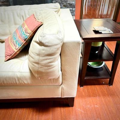 Pale yellow leather tuxedo-style sofa - finished on all sides