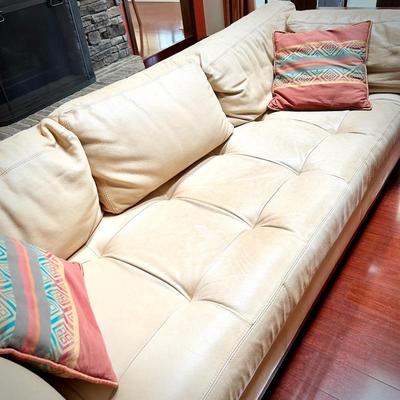 Pale yellow leather tuxedo-style sofa - finished on all sides