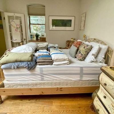 Queen-sized bed with linens