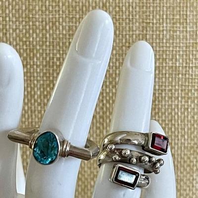 (2) Sterling Silver Rings Faceted Garnet & Blue Topaz - Both Size 4.5 - Total Weight 12.9 Grams 