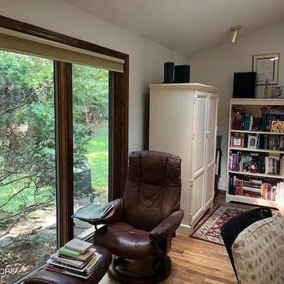 Stressless chair and ottoman, computer armoire, bookcase