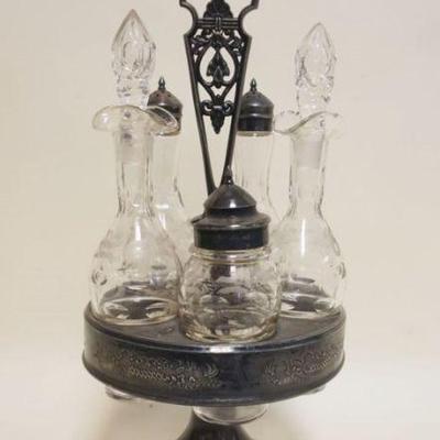 1084	ANTIQUE SILVERPLATE CASTOR SET W/5 BOTTLES, APPROXIMATELY 17 IN HIGH
