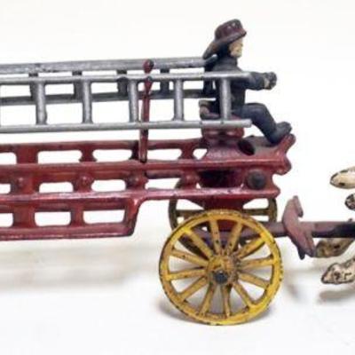 1012	VINTAGE CAST IRON TOY HORSE DRAWN FIRE WAGON, APPROXIMATELY 15 IN X 3 IN X 5 IN HIGH
