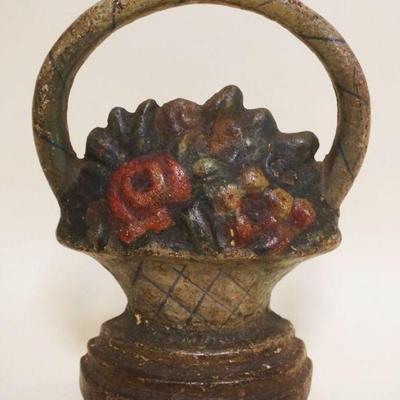 1106	CAST IRON BASKET DOORSTOP, APPROXIMATELY 9 IN HIGH
