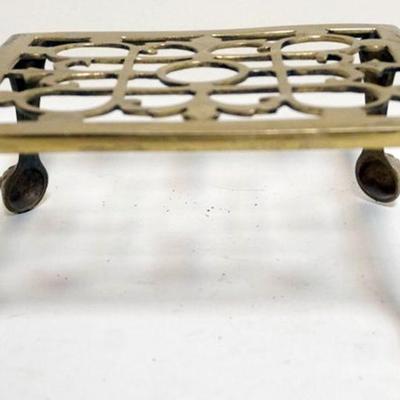 1024	ANTIQUE BRASS CLAW FOOT TRIVIT, APPROXIMATELY 7 IN X 8 IN X 4 IN HIGH
