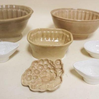 1097	GROUP OF ASSORTED ANTIQUE FOOD MOLDS, LARGEST APPROXIMATELY 6 IN X 8 IN X 4 IN
