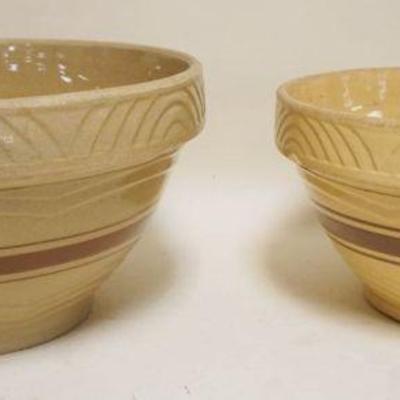 1098	2 BANDED YELLOWARE MIXING BOWLS, LARGEST APPROXIMATELY 14 IN X 8 IN
