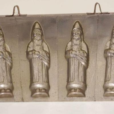 1003	ANTIQUE CHOCOLATE SANTA CLAUS MOLD, APPROXIMATELY 6 IN X 11 IN
