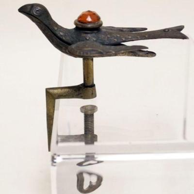 1026	ANTIQUE BRASS SEWING BIRD W/AMBER JEWELED GLASS TOP
