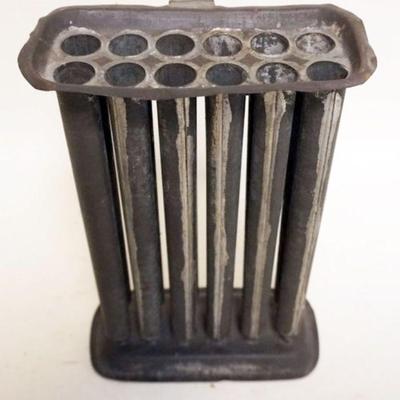 1032	ANTIQUE TINE 12 PART CANDLE MOLD, APPROXIMATELY 7 IN X 4 IN X 11 IN H
